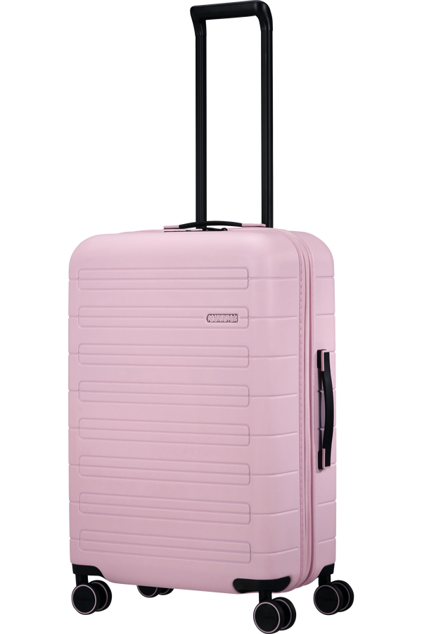American tourister pink carry on top